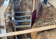 2 die as earth caves in at construction site in TN