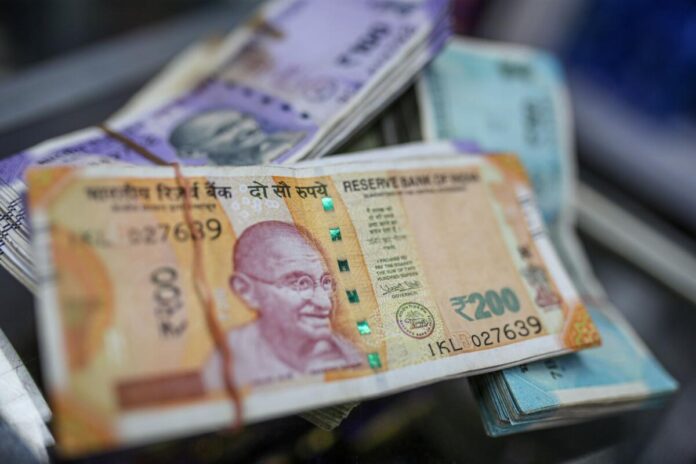 Rupee falls 14 paise to close at 82.35 against US dollar